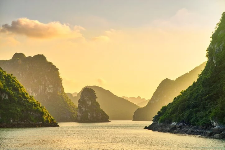 Dreamy sunset among the rocks of Halong Bay, Vietnam