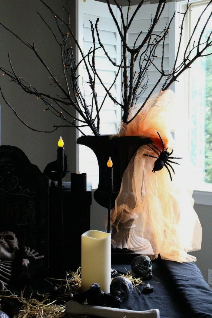 halloween deko stilvolle dekoration mit kerzen und zweigen