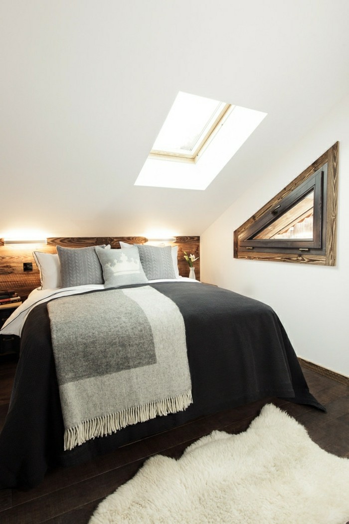 schlafzimmer dachschräge schwarze bettwäsche und weißer fellteppich