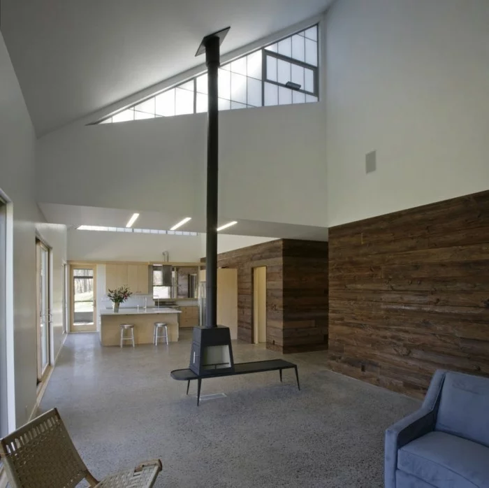 betonboden offener wohnplan hölzerne wandgestaltung moderne möbel