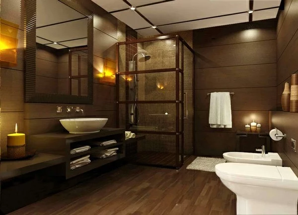 modernes Badezimmer in Braun mit weißen Sanitärobjekten, moderner Duschkabine und Kerzen