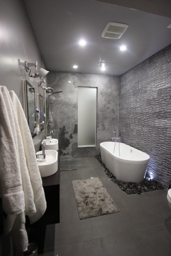badezimmer grau weiße badewanne steine