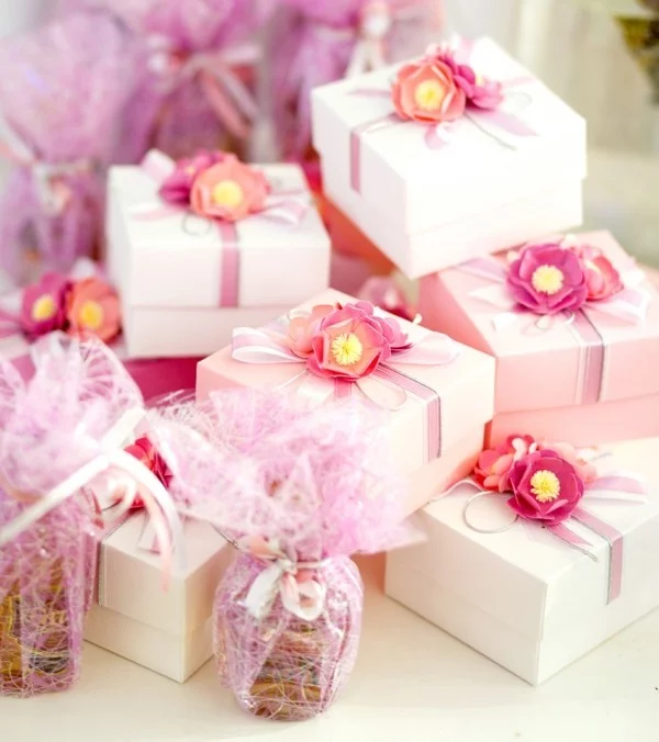 Gifts boxes for guests in rose color with ribbon