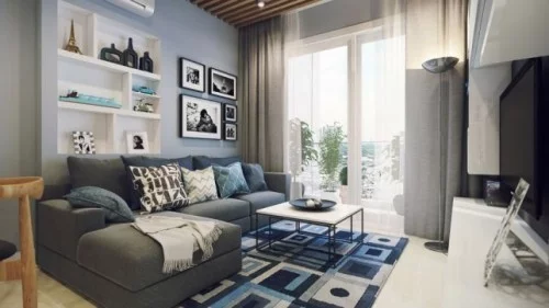 wohnzimmer einrichten ideen hellblaue wandfarbe geometrischer teppich