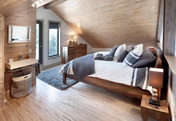 Schlafzimmer unter Schräge warme Farben beige viel Holz kanadische Traumhäuser