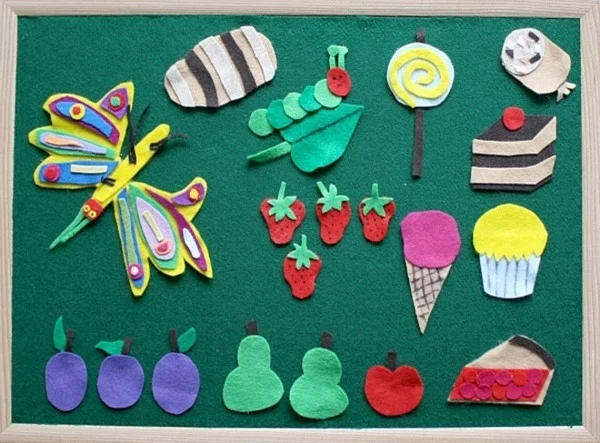 DIY Spielzeuge activity board Babyspielzeug selber machen kleine Figuren aus Filz Stück Torte Birnen Äpfel Eis 