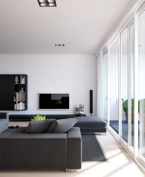 Minimalismus im Wohnzimmer Ecksofa in Grau schlichtes Design