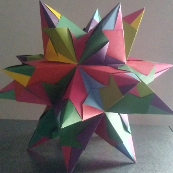 großen Bascetta Stern basteln aus farbenfrohem Papier Anleitung für bunten 3D Stern