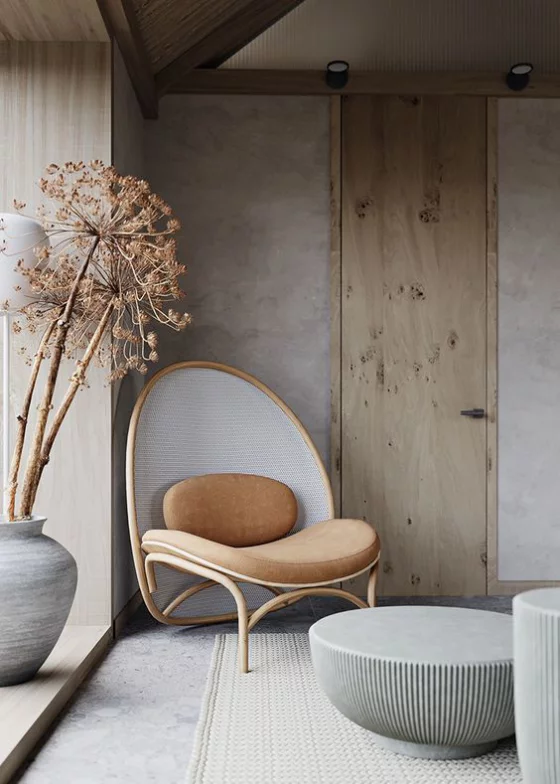 Zeitgemäße Raumgestaltung helles einfach gestaltetes Ambiente runder Stuhl runde Formen ziehen die Blicke an