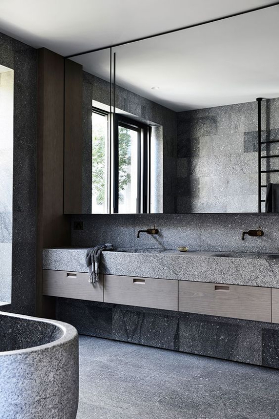 Baddesigns in Grau grober Stein raue Oberflächen verschiedene Nuancen von Grau schöne Badgestaltung