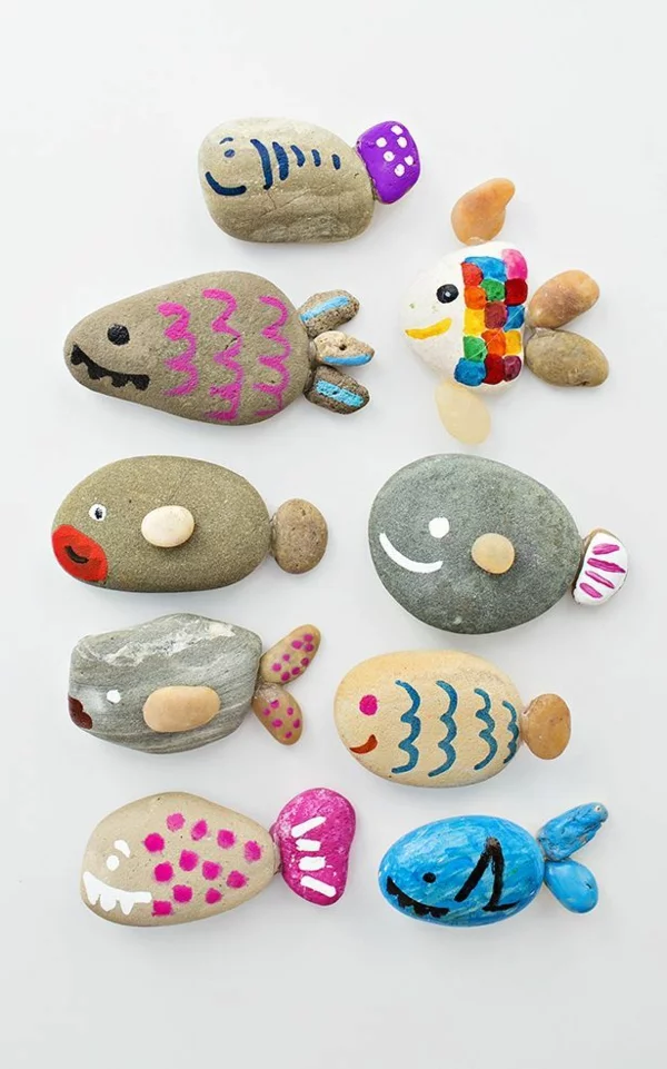 Basteln mit Kindern - bemalte Steine wie Fische 