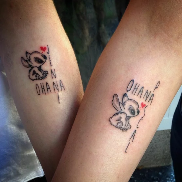 Stitch Ohana Tattoos mit Herzen am Unterarm