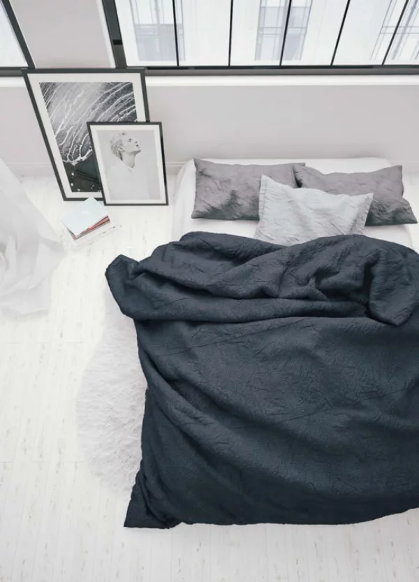 Schlafzimmer minimalistisch einrichten drei Farben vorherrschen Weiß Grau Schwarze Schlafbett