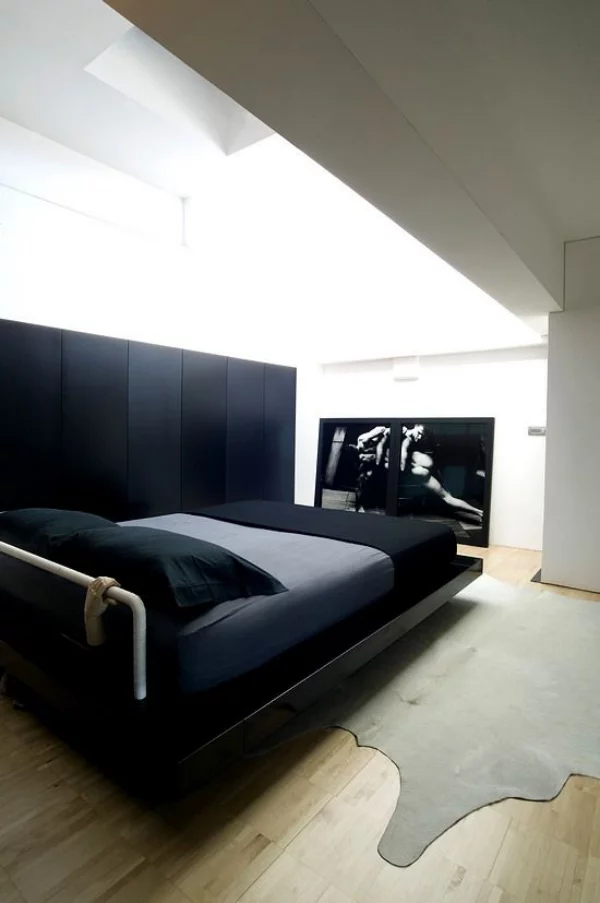Schlafzimmer minimalistisch einrichten schwarzes Bett etwas Extravaganz mitbringen