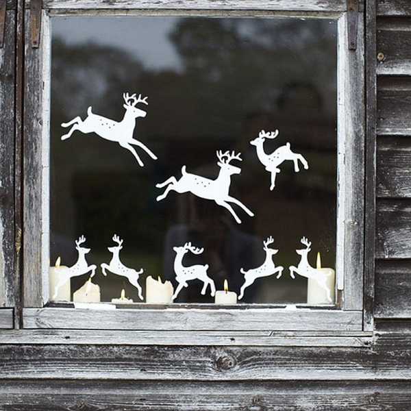 Fensterbilder basteln zu Weihnachten – zauberhafte Ideen und Anleitungen rentiere papierschnitte deko diy