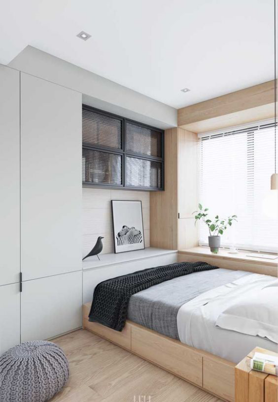 kleines Schlafzimmer optisch erweitern helles Ambiente deckenhohe eingebaute Kleiderschränke gute Staumöglichkeit Grau Weiß Anthrazit dominieren