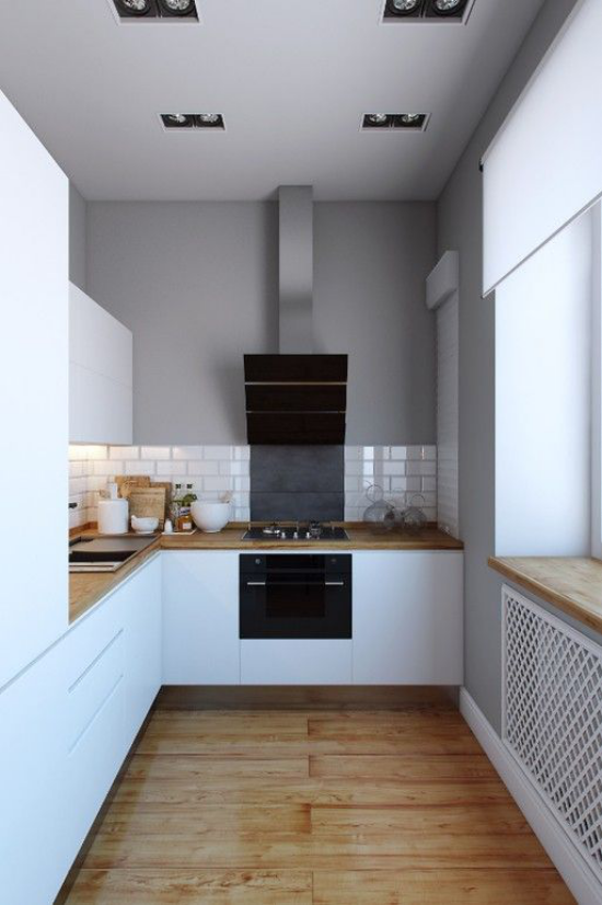 U-Küche sauberes Küchendesign weiße Schränke weiße Metro Fliesen Arbeitsplatten aus Holz