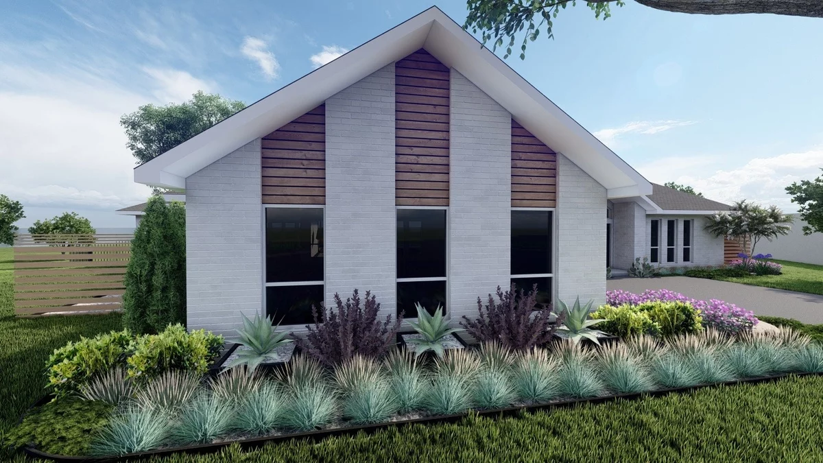 die Blumen im Vorgarten passen gut zum Baustil des Hauses