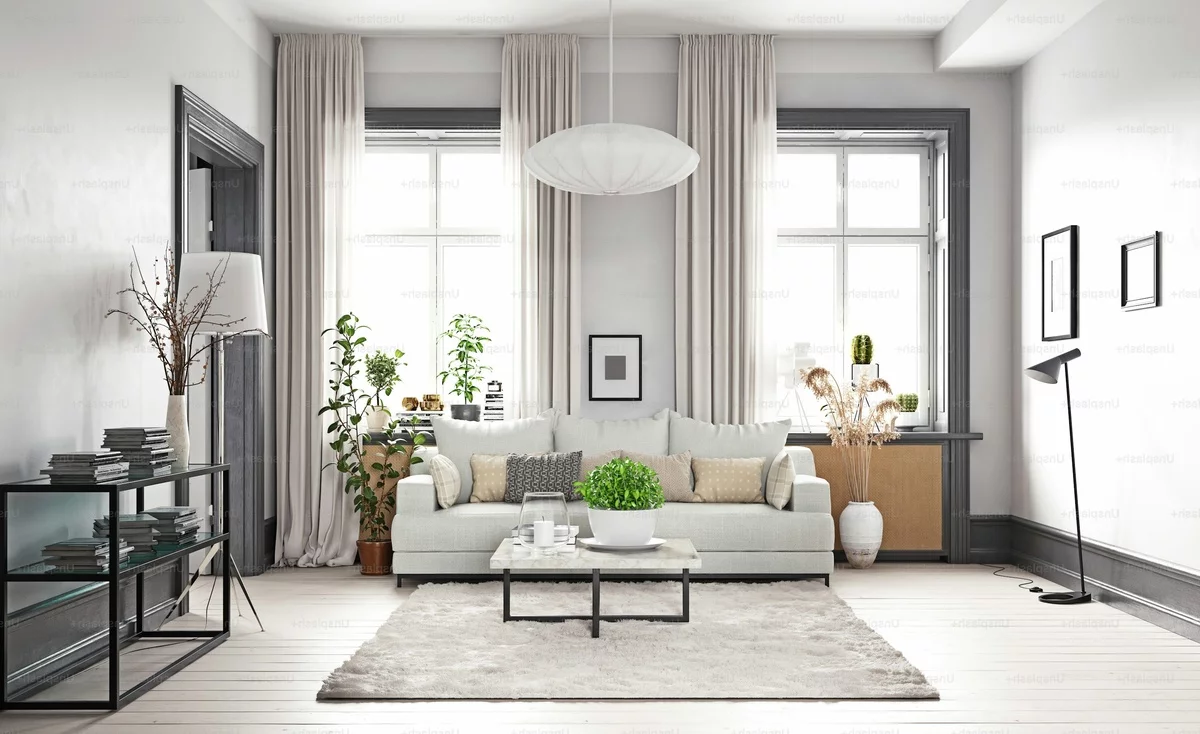 ein minimalistisch eingerichtetes modernes Wohnzimmer in Grau und Weiß