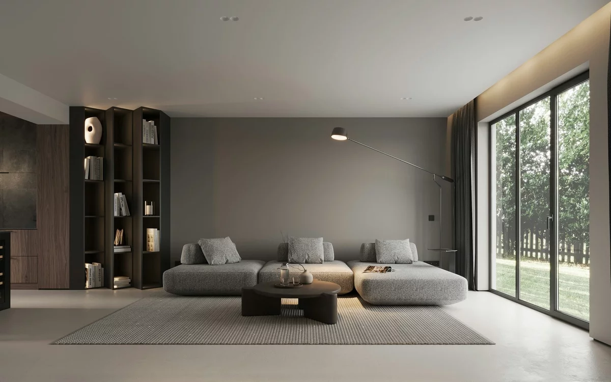 grau gestaltetes Wohnzimmer mit schwarzen Wandregalen wirkt etwa mystisch