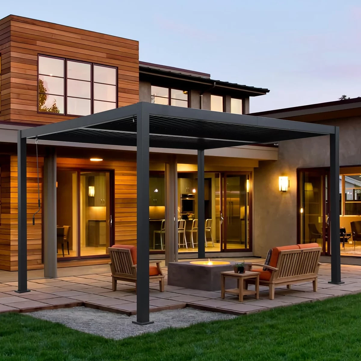 Gartenlaube aus Metall am Haus mit Relax-Zone und Beleuchtung 