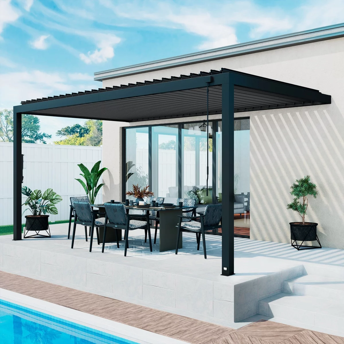 schwarze Gartenlaube aus Metall mit dunklen Stühlen und Tisch eingerichtet 