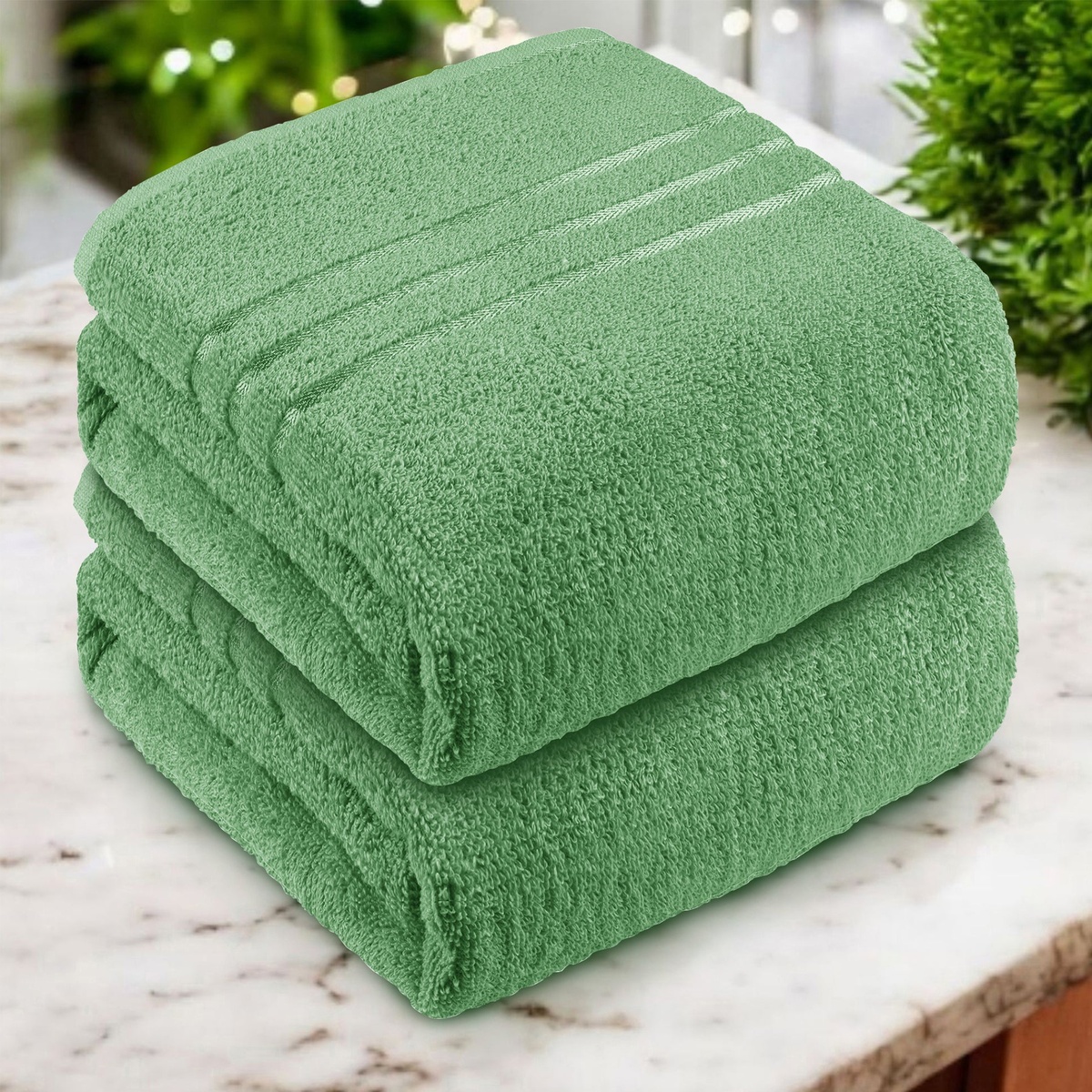 ein 2er Set Duschtücher in Grün